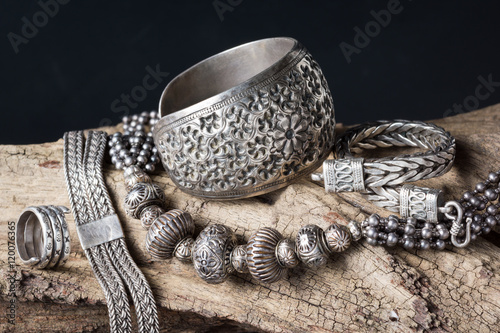 traditional silver jewelry on old wood photo