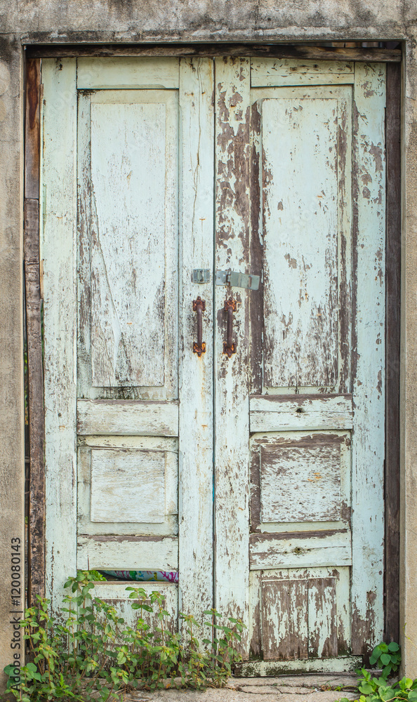 retro wood door closed, grunge peeling paint old vintage wooden house door.