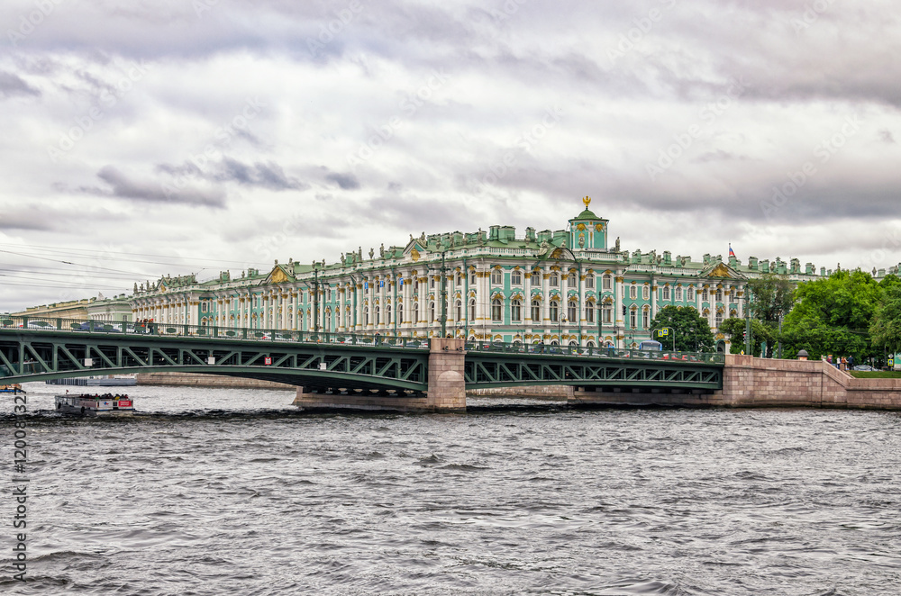 Saint Petersburg, Russia. A view from river bus on the Neva river. The Dvortsovy (Palace) bridge and the Hermitage in the gloomy weather.