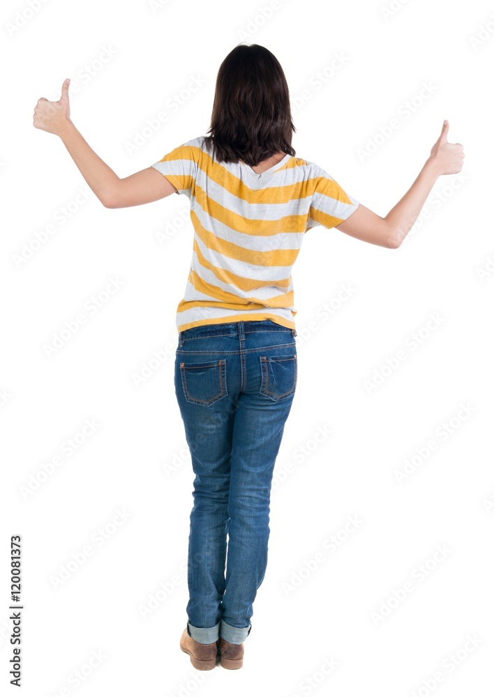 Back view of woman thumbs up. Rear view people collection. backside view of person. Isolated over white background. slender brunette in a jeans shows the symbol of success or hitchhiking Back view of woman thumbs up. Rear view people collection. backside view of person. Isolated over white background. slender brunette in a jeans shows the symbol of success or hitchhiking