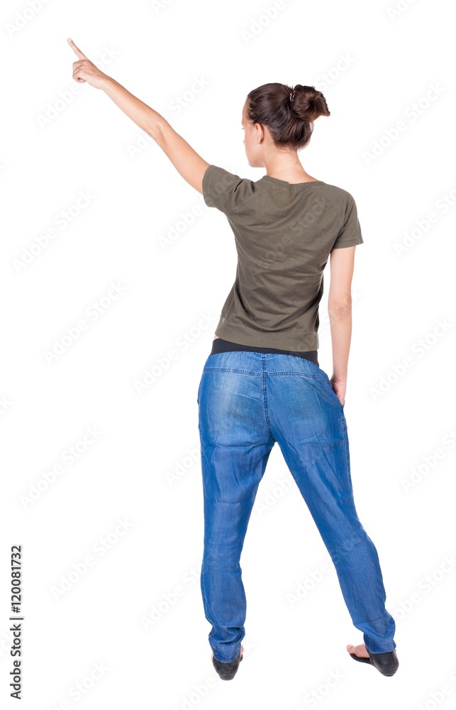 Back view of pointing woman. beautiful brunette girl in jeans. Rear view people collection. backside view of person. Isolated over white background. Back view of pointing woman. beautiful brunette girl in jeans. Rear view people collection. backside view of person. Isolated over white background.