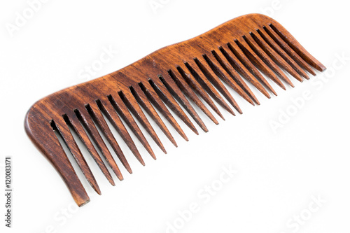wooden hairbrush or comb with some dandruff