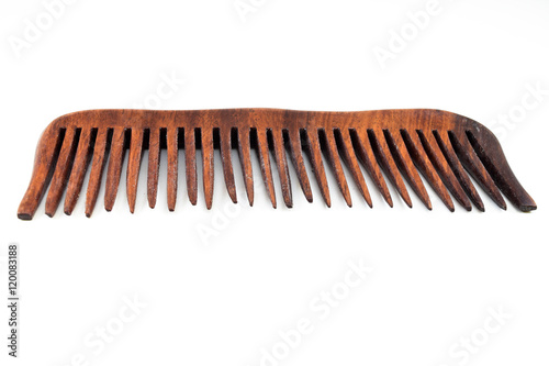 wooden hairbrush or comb with some dandruff