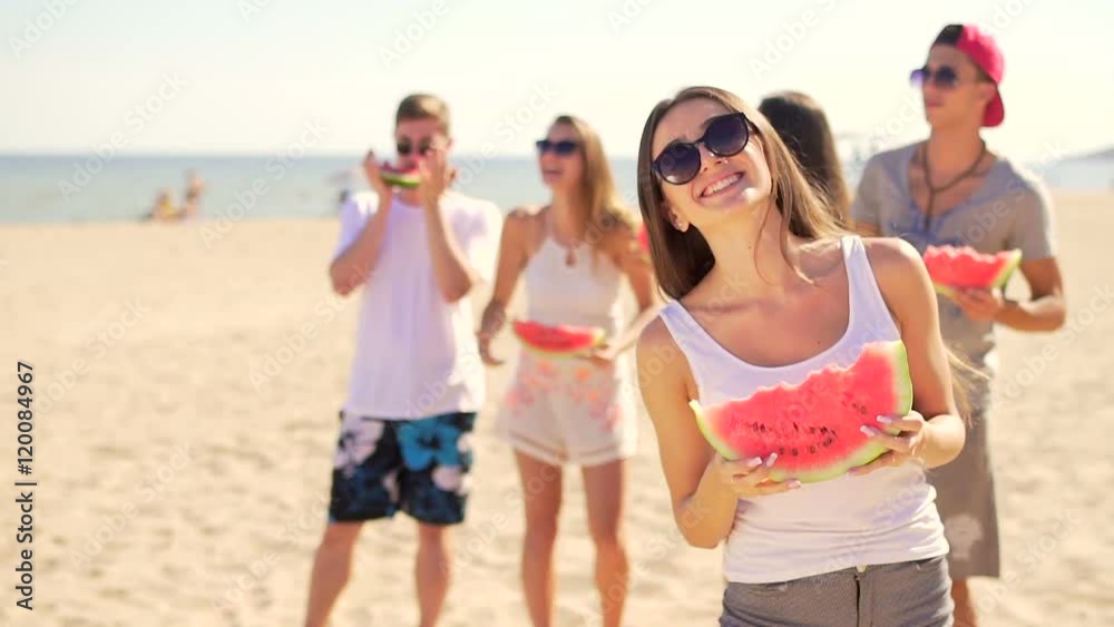Beautiful girl rejoices with watermelon on the beach Beautiful girl rejoices with watermelon on the beach