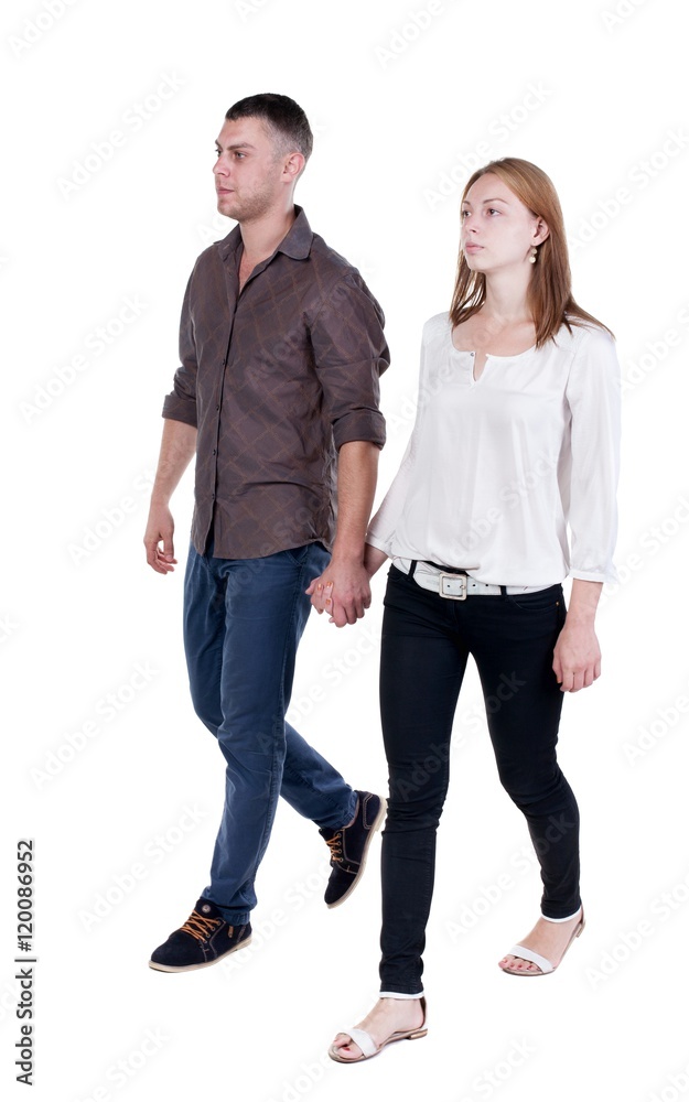 Back view going couple in jeans. walking friendly girl and guy holding hands. Rear view people collection. backside view of person. Isolated over white background. Back view going couple in jeans. walking friendly girl and guy holding hands. Rear view people collection. backside view of person. Isolated over white background.