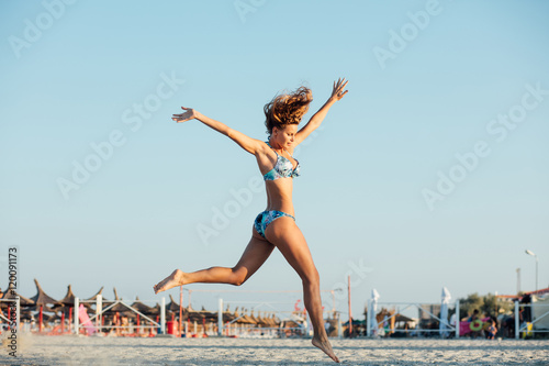 jumping woman on a bech