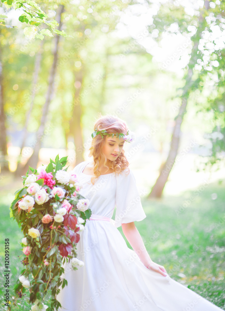 Beautiful bride with a gorgeous bouquet of fresh air