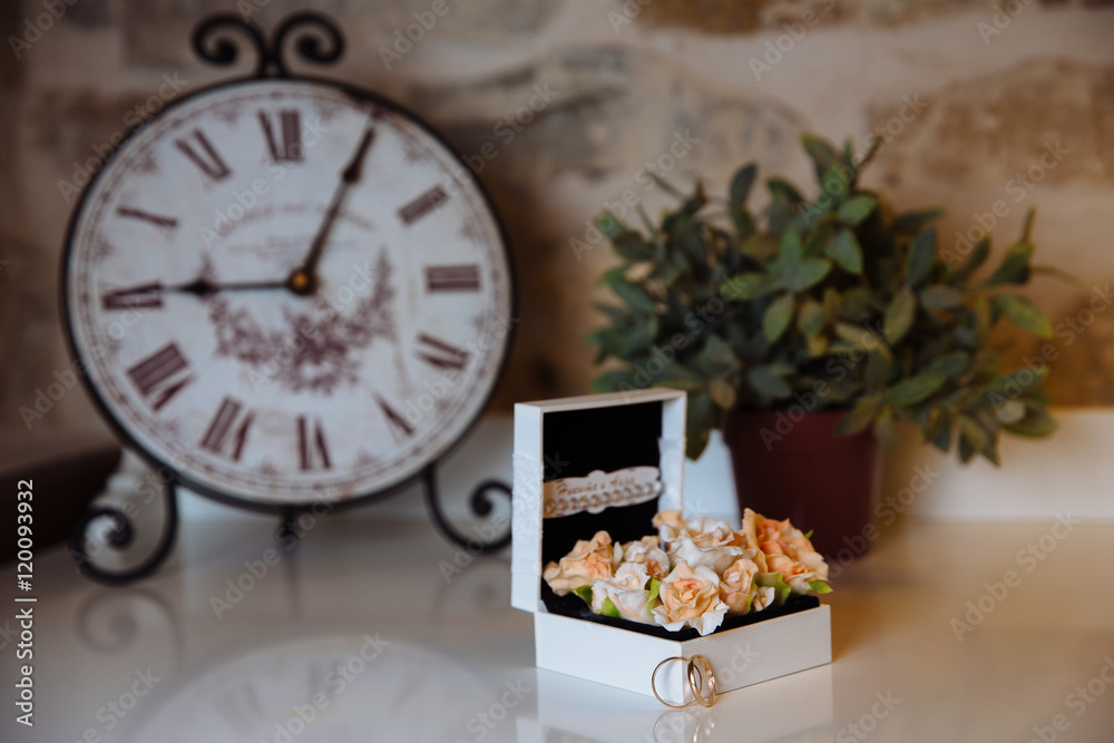 Wedding rings in a box on white table. Concept of marriage