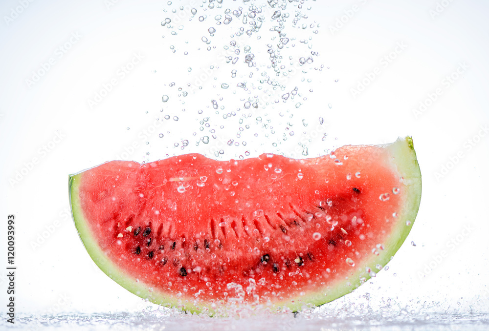 Red watermelon slice with splash of water Red watermelon slice with splash of water