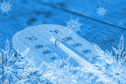 cool thermometer, ice frost snowflake temperature freeze day concept.