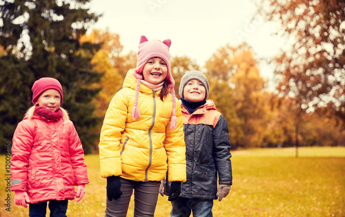 group of happy children in autumn park