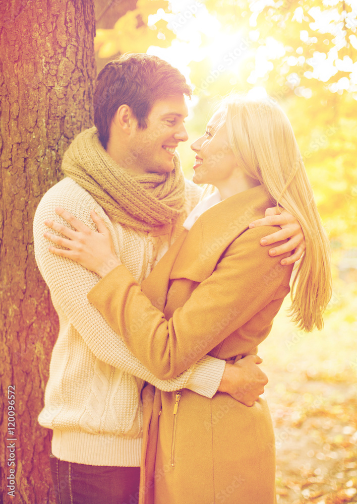 Fototapeta premium romantic couple kissing in the autumn park
