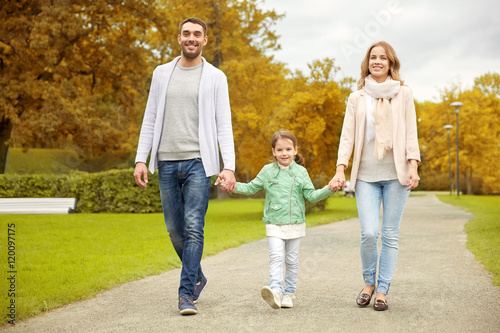 happy family walking in autumn park