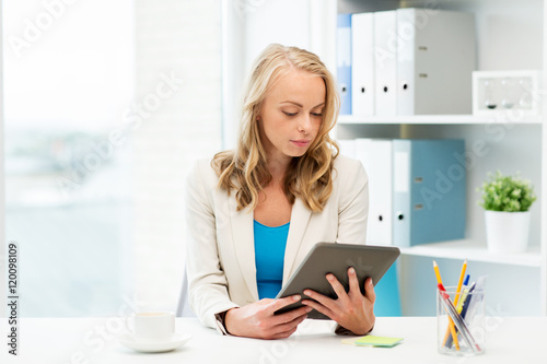 businesswoman or student with tablet pc at office