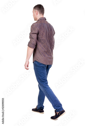 Back view of going handsome man in jeans and a shirt. walking young guy . Rear view people collection. backside view of person. Isolated over white background.