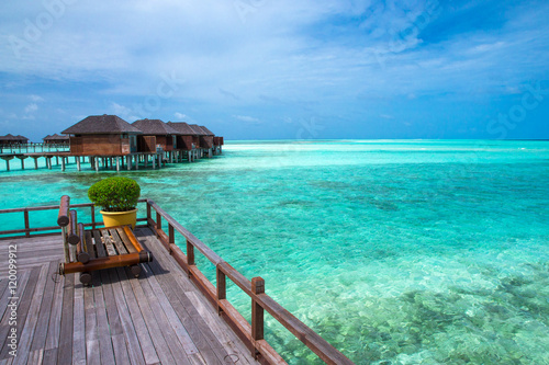 beach with water bungalows at Maldives