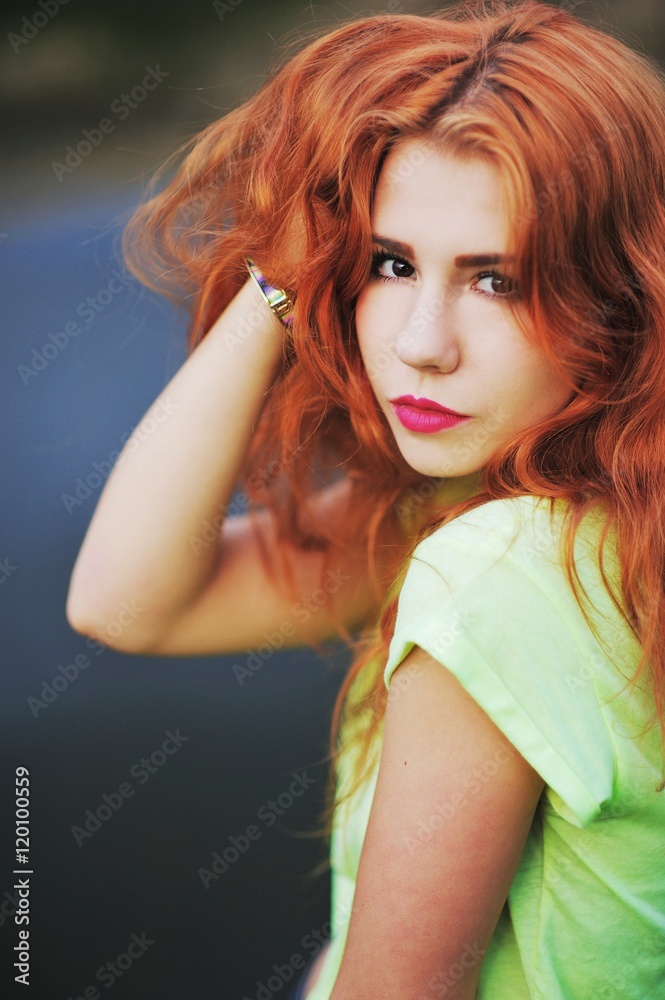 Fototapeta premium Portrait of an adorable brown-eyed girl. The young girl straight