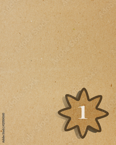paper star with number one stick on recycled paper background