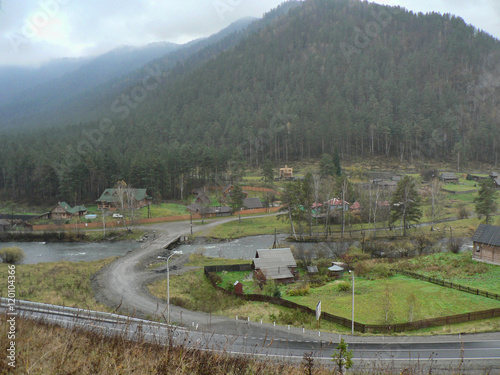 Small village in the valley between the mountains photo