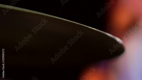 Extreme close up of a cymbal in a marching band getting hit.