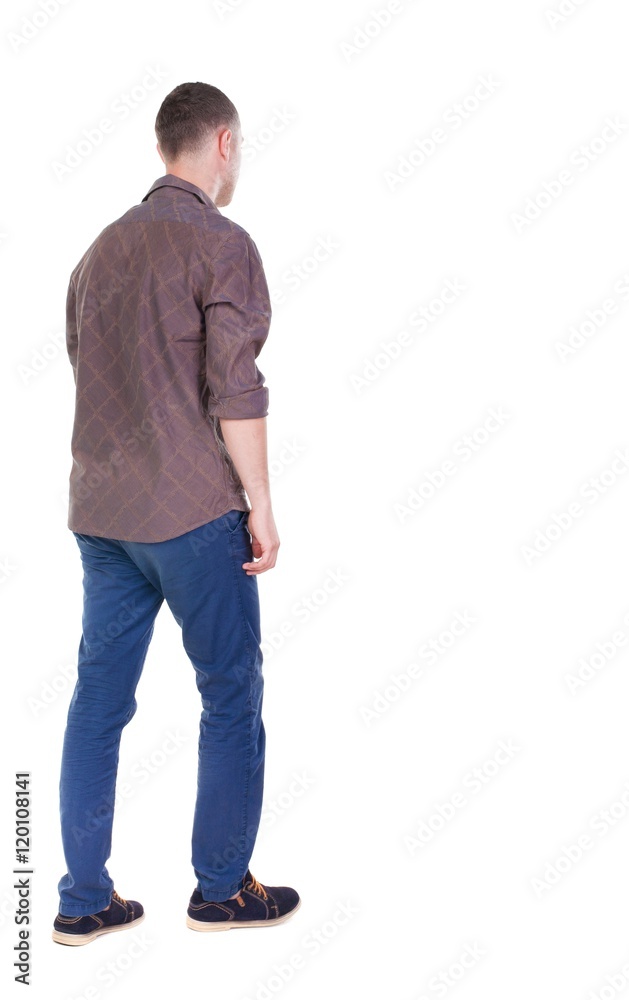 Back view of going handsome man in jeans and a shirt. walking young guy . Rear view people collection. backside view of person. Isolated over white background. Back view of going handsome man in jeans and a shirt. walking young guy . Rear view people collection. backside view of person. Isolated over white background.
