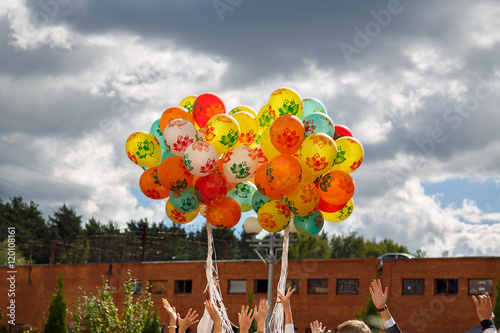 Bunch of balloons rising into the sky at the celebration of the beginning of the new school year in Russia. photo