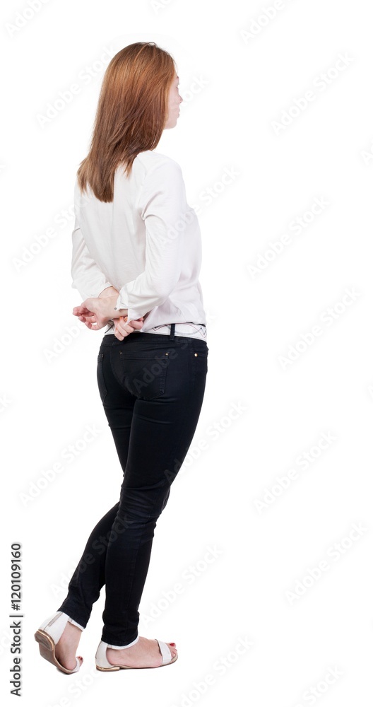 back view of standing young beautiful blonde woman in jeans. girl watching. Rear view people collection. backside view of person. Isolated over white background. back view of standing young beautiful blonde woman in jeans. girl watching. Rear view people collection. backside view of person. Isolated over white background.