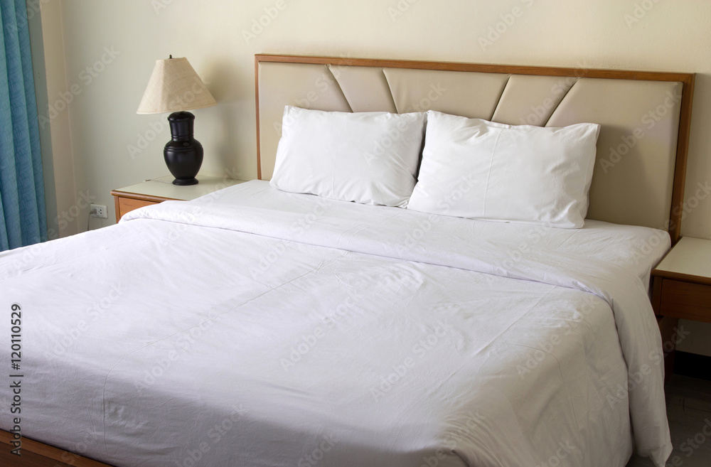 bedroom interior with pillow and table lamp