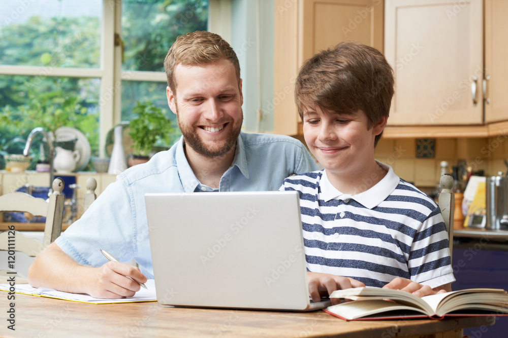Male Home Tutor Helping Boy With Studies Male Home Tutor Helping Boy With Studies