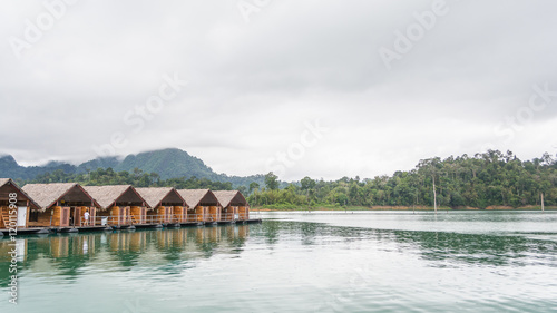 Wooden resort on the water in Ratchaprapha dam with beautiful mo