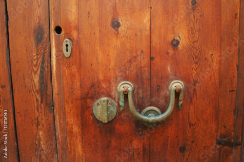 Old wooden door with metal handle