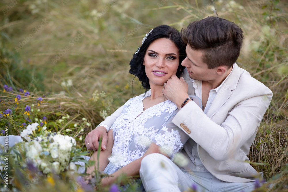 Young couple in love outdoor. Elegant bride and groom posing together outdoors on a wedding day. bride and groom in the Park. young couple in the woods. young couple in the grass. couple walking Young couple in love outdoor. Elegant bride and groom posing together outdoors on a wedding day. bride and groom in the Park. young couple in the woods. young couple in the grass. couple walking