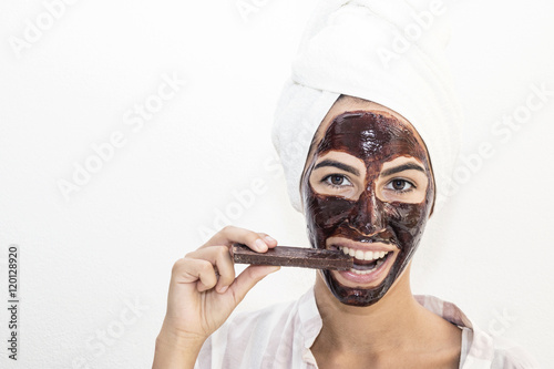 Chocolate facial mask. Chocolate therapy. photo