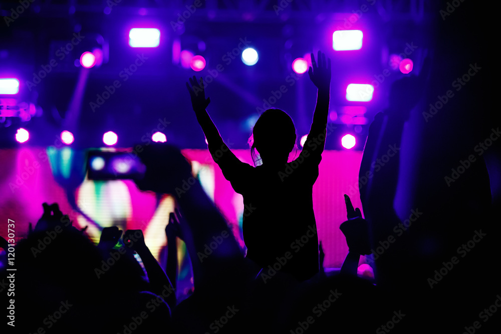 Fototapeta Black silhouette of young girl on rock concert, openair fest party