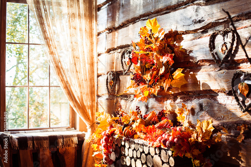 Sunlight shining through a window in a room with wooden walls an
