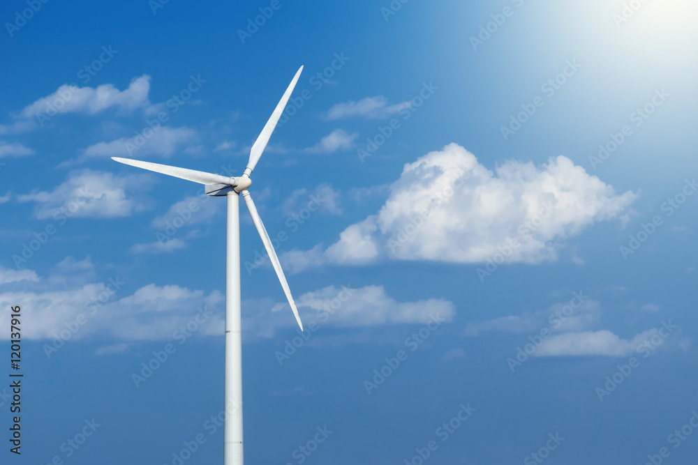 Energy windmill produce energy on blue sky at daytime Energy windmill produce energy on blue sky at daytime