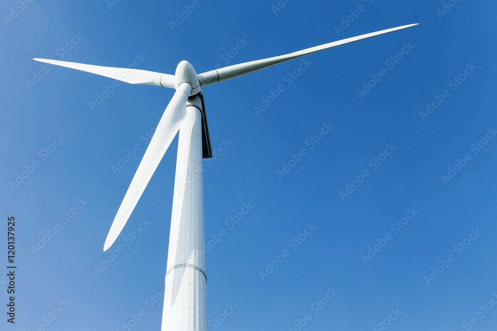 Energy windmill produce energy on blue sky at daytime Energy windmill produce energy on blue sky at daytime