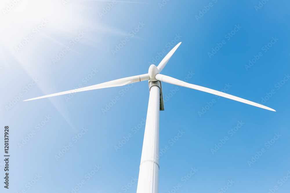 Energy windmill produce energy on blue sky at daytime Energy windmill produce energy on blue sky at daytime