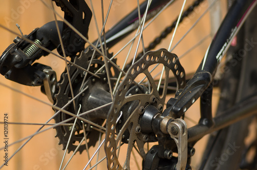 Closeup detailed look at bicycle wheel gear shifting mechanics during maintenance repairs