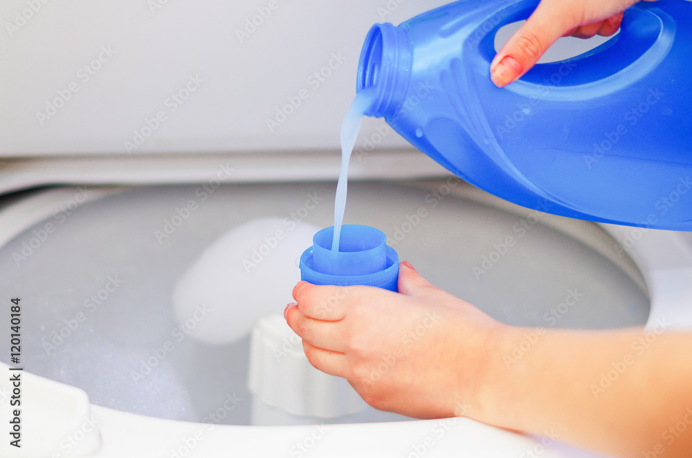 Woman Hand Pouring Washing Powder Measuring Cup Granular Solid