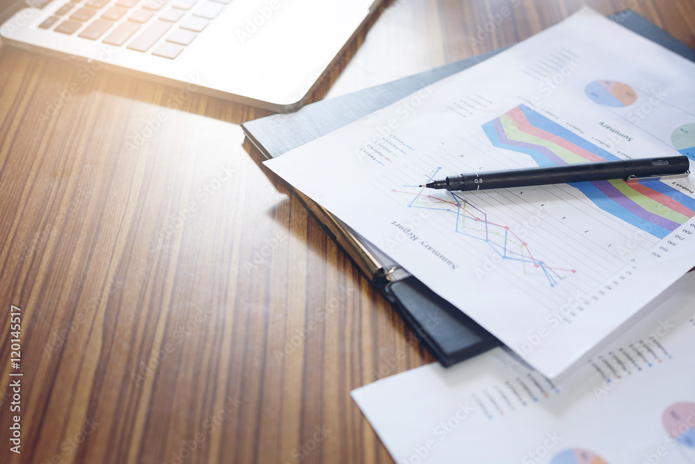 Functional devices, laptop and business data on the table. Functional devices, laptop and business data on the table.