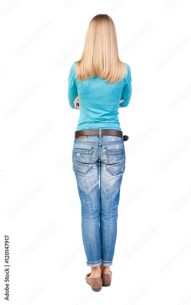back view of standing young beautiful woman in jeans. girl watching. Rear view people collection. backside view of person. Isolated over white background. back view of standing young beautiful woman in jeans. girl watching. Rear view people collection. backside view of person. Isolated over white background.