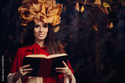 Εκτύπωση καμβά Woman With Autumn Leaves Crown Reading a Book