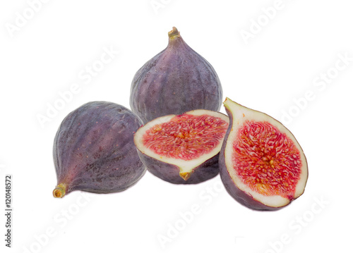 Several fresh fig fruit on a light background