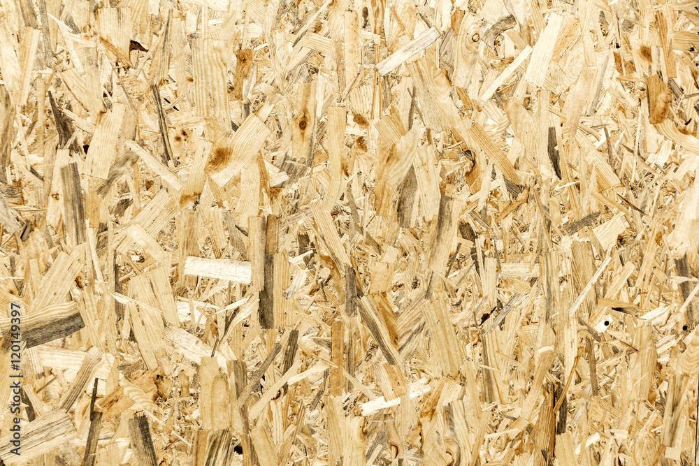Pressed wooden panel background, seamless texture of oriented st Pressed wooden panel background, seamless texture of oriented st