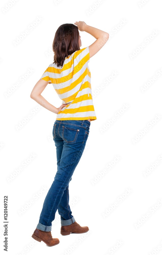 back view of standing young beautiful brunette woman in yellow t-shirt. girl watching. Rear view people collection. backside view of person. Isolated over white background. back view of standing young beautiful brunette woman in yellow t-shirt. girl watching. Rear view people collection. backside view of person. Isolated over white background.