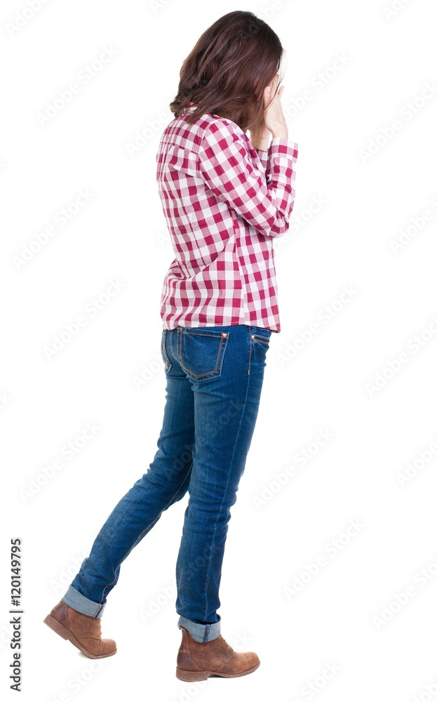 Back view of shocked woman in checkered shirt. girl hid his eyes behind his hands. Rear view people collection. backside view of person. Isolated over white background. Back view of shocked woman in checkered shirt. girl hid his eyes behind his hands. Rear view people collection. backside view of person. Isolated over white background.