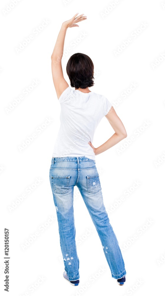 Back view of beautiful woman welcomes. Young teenager girl in jeans hand waving from. Rear view people collection. backside view of person. Isolated over white background. Back view of beautiful woman welcomes. Young teenager girl in jeans hand waving from. Rear view people collection. backside view of person. Isolated over white background.