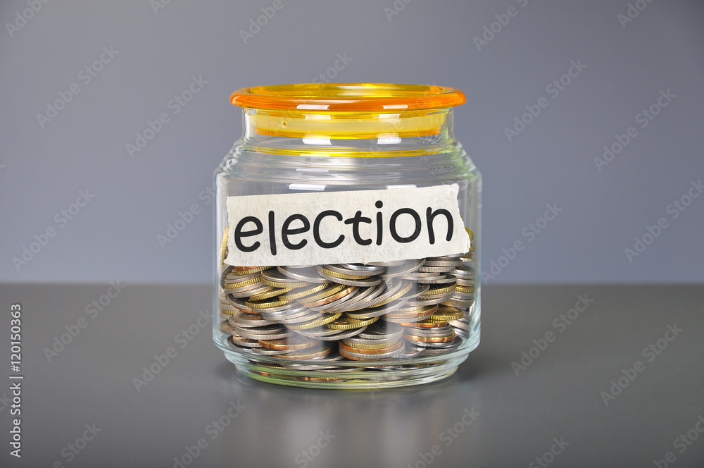 Saving concept of coins in the glass jar for election purpose Saving concept of coins in the glass jar for election purpose