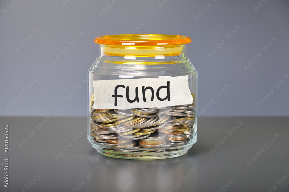 Saving concept of coins in the glass jar for fund purpose Saving concept of coins in the glass jar for fund purpose